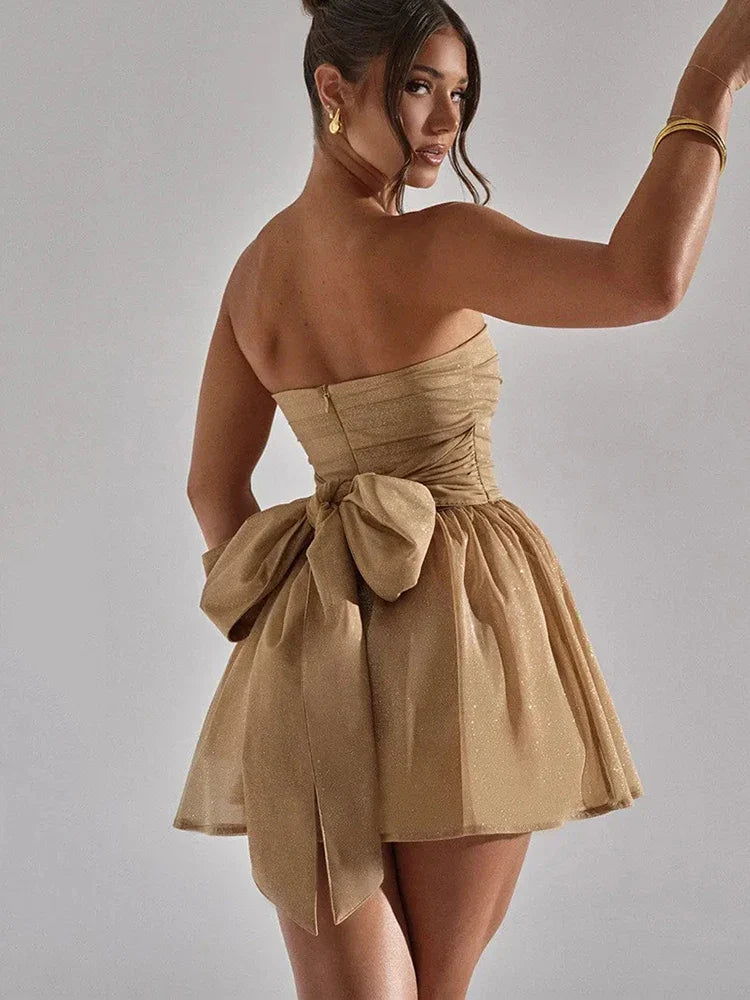 Elegant strapless mini dress for women, featuring a pleated bodice and a stylish flared hem.