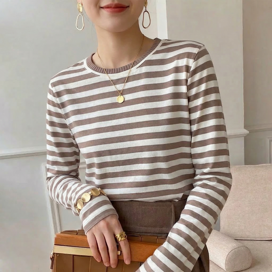 Breathable women's long sleeve top with classic stripes, made from soft cotton for ultimate comfort.