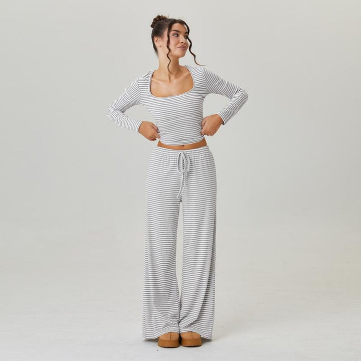 Two-piece women's lounge set featuring a soft striped jersey fabric, square neck top, and wide-leg pants.