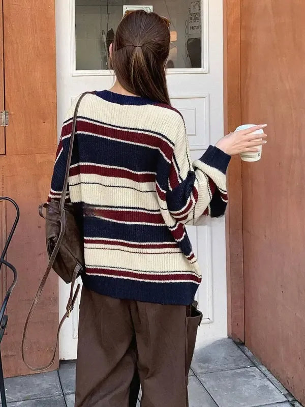 Oversized women's sweater, a striped knit wool blend in a relaxed fit, ideal for cozy winter wear