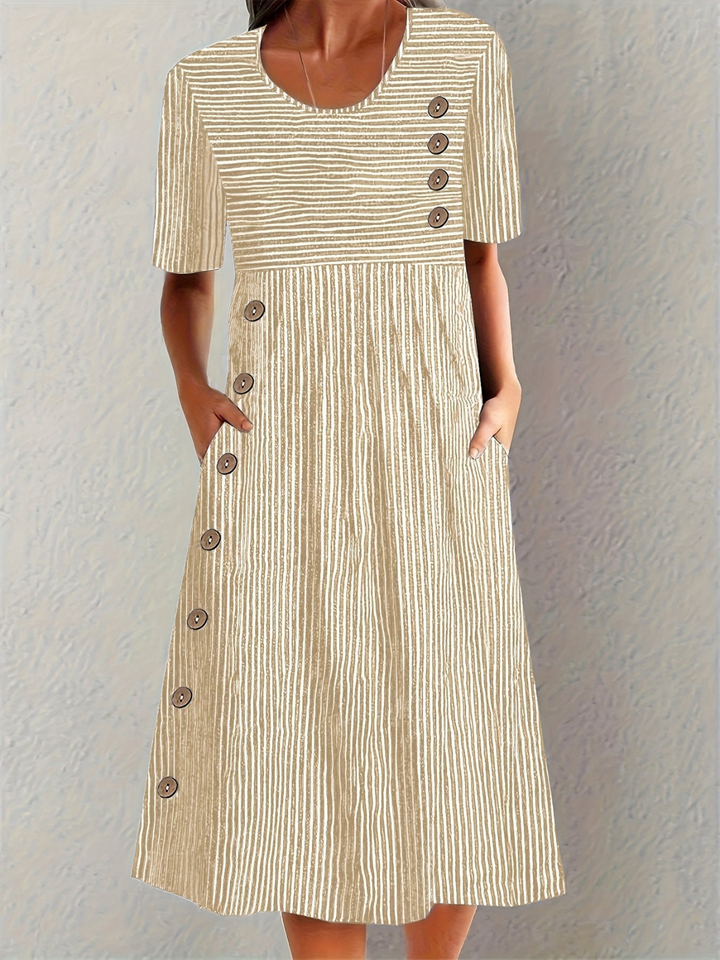 Elegant women's striped midi dress with delicate button details, convenient pockets, and a comfortable design.