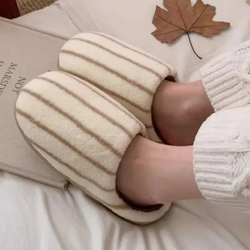 Pair of women's comfort house slippers with soft fleece and stylish striped pattern