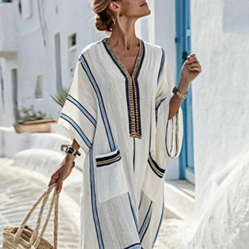 Oversized women's striped kaftan maxi dress, ideal casual loungewear or chic summer vacation outfit.