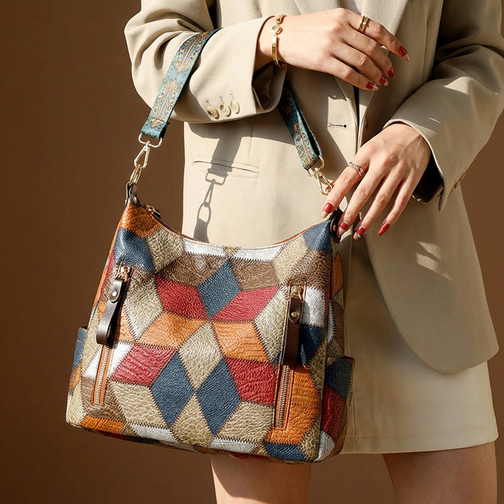 Close-up of the contrast stitching detail on a women's fashionable shoulder bag.