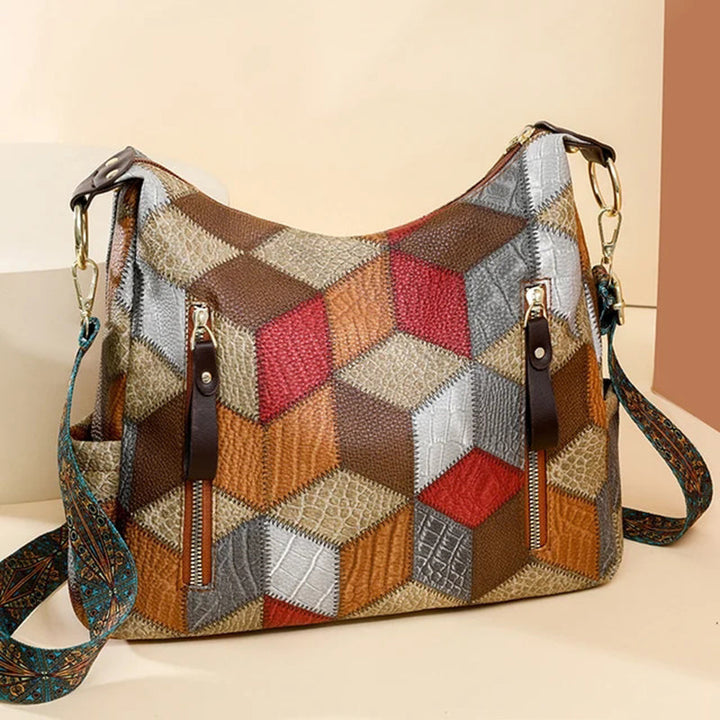 Stylish women's black handbag with contrast stitching, showing a model wearing it.