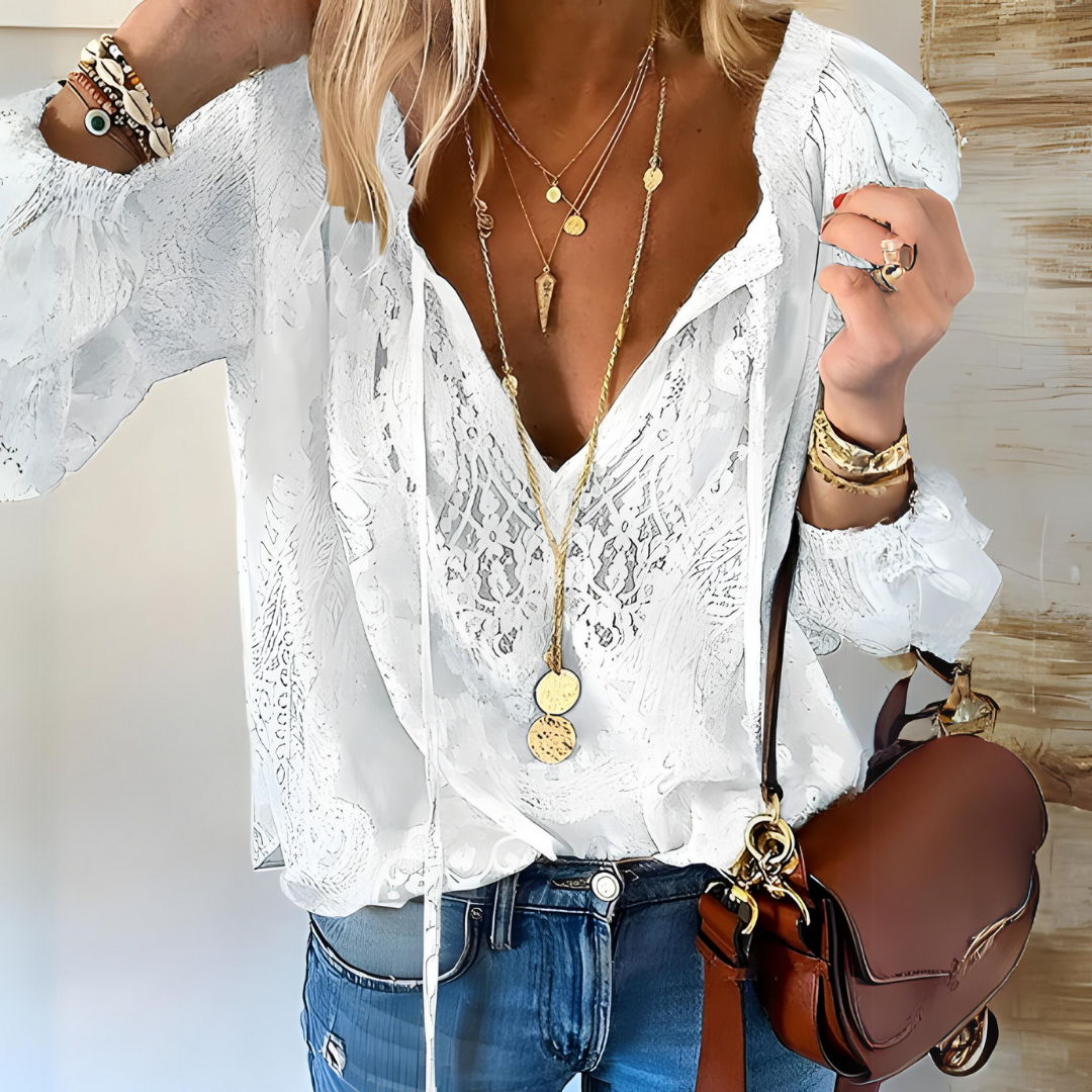 Stylish women's boho blouse, intricately crocheted. Versatile loose-fit top for summer, beach, or casual wear.