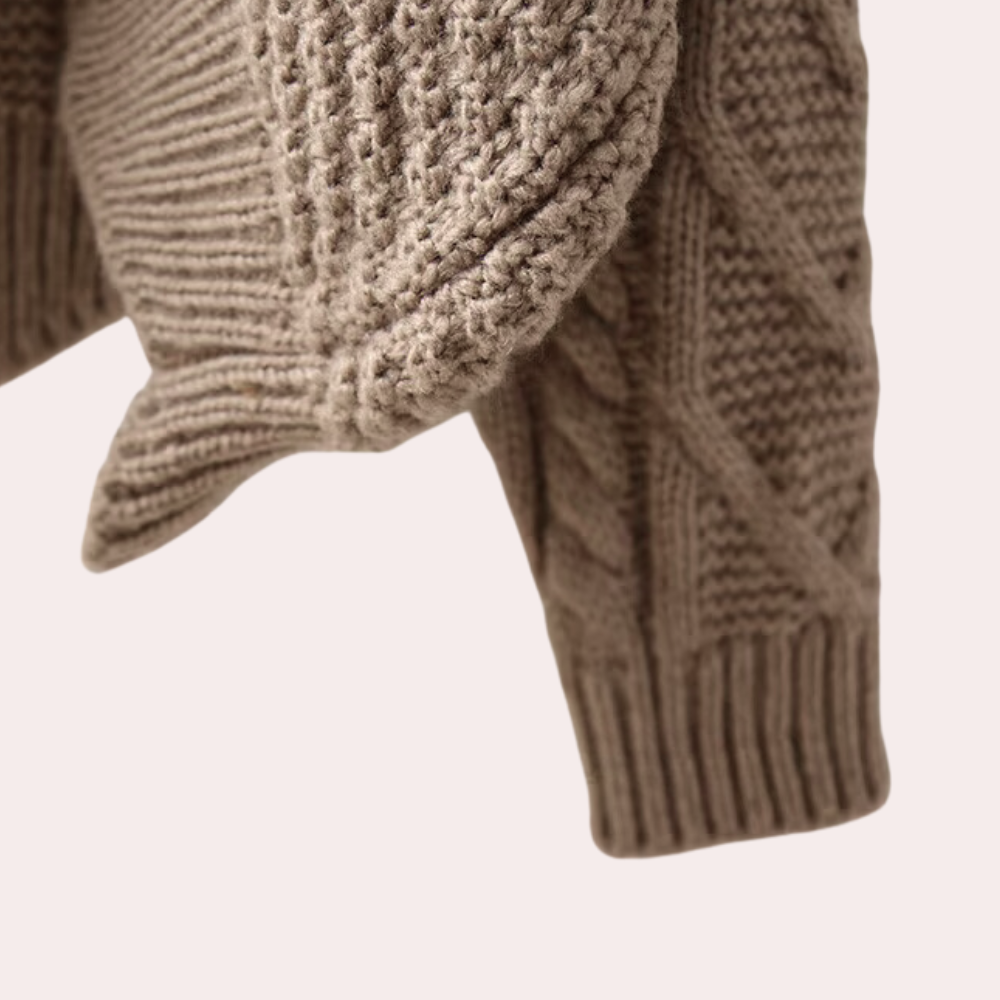 Women's warm knitted turtleneck sweater. Stylish cotton knit, long sleeve top for versatile winter fashion.