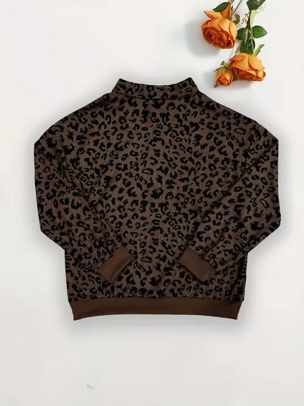 Leopard print half-zip knit sweater for women, showcasing a comfortable relaxed fit