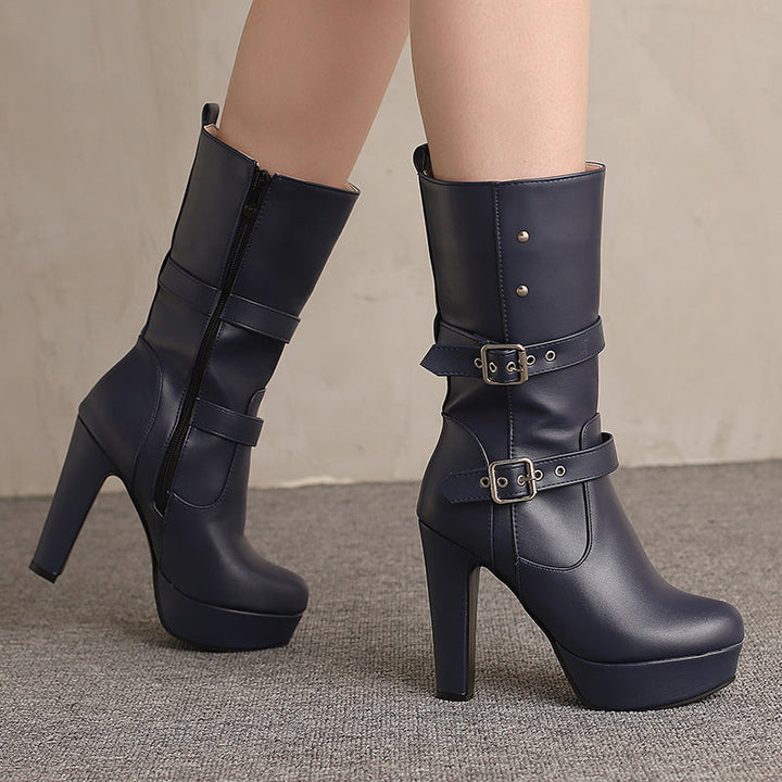 Pair of black heeled buckle boots for women, showcasing sleek design and stacked heel