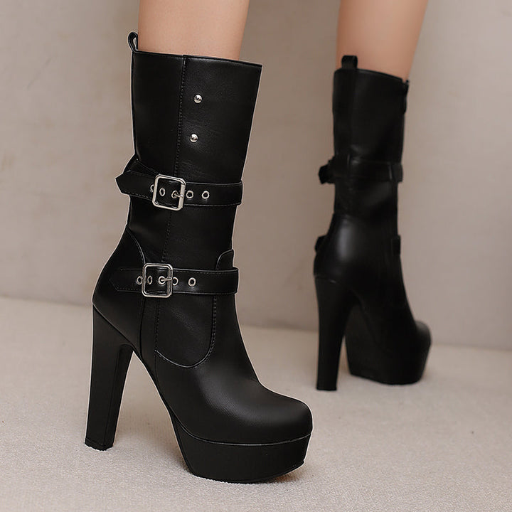 Women's fashion mid-calf boots with prominent double buckles, angled view, winter footwear