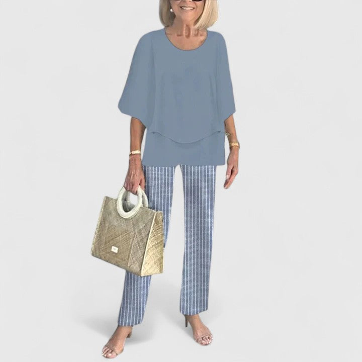 Elegant women's two-piece ensemble with a plain crew neck top and stylish, comfortable printed casual pants.