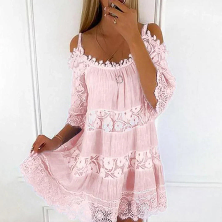 Boho-style women's summer mini dress, crafted with beautiful crochet lace and detailed floral embroidery.