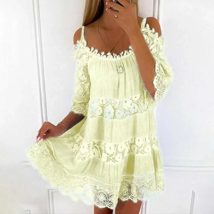 Stylish women's casual mini dress with cold shoulder, intricate crochet lace, and lovely embroidery for summer.