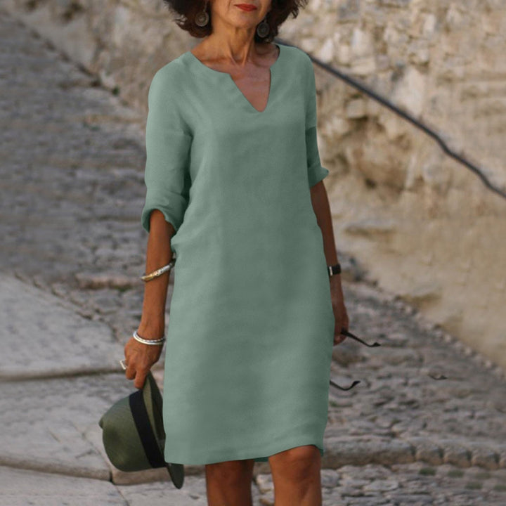 Elegant women's shift midi dress with V-neck, ideal for summer style, comfort & versatility.
