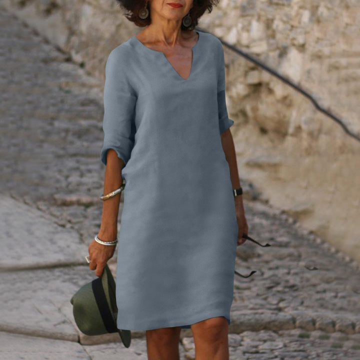 Comfortable women's V-neck midi dress, versatile for warm weather, parties, and everyday style.