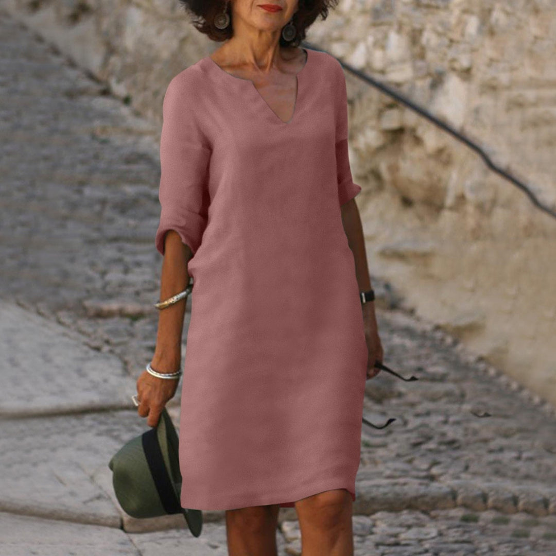 Chic women's V-neck midi dress, a stylish choice for summer vacations, beach trips & casual wear.
