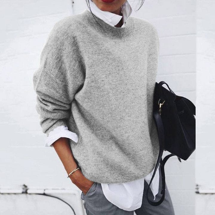 Model wearing a versatile women's super soft round neck knit pullover, ideal for winter fashion.