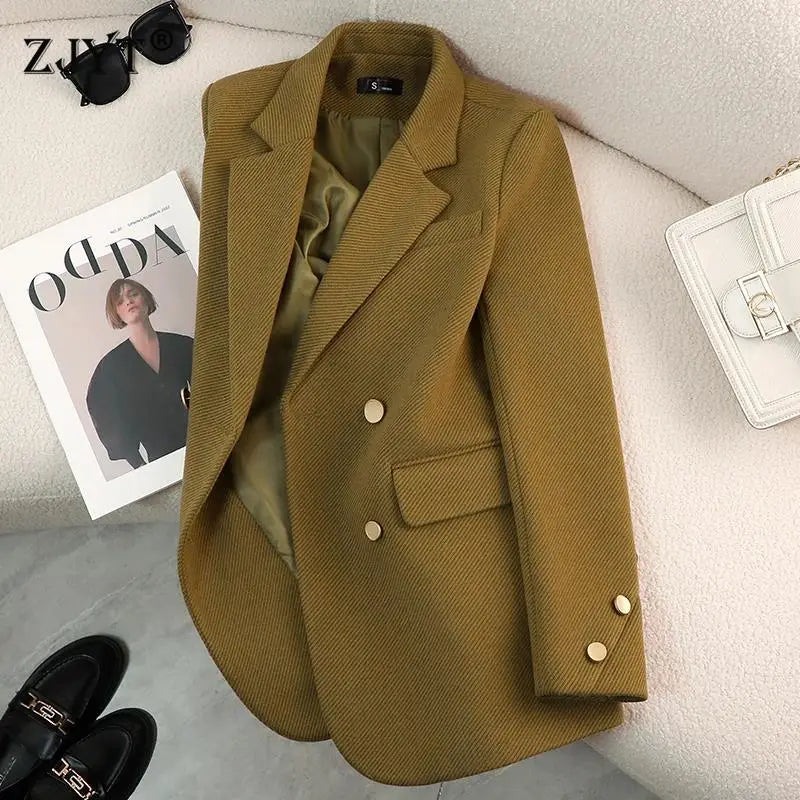 Women's tailored blazer in a sophisticated black, featuring elegant gold button accents and a structured fit