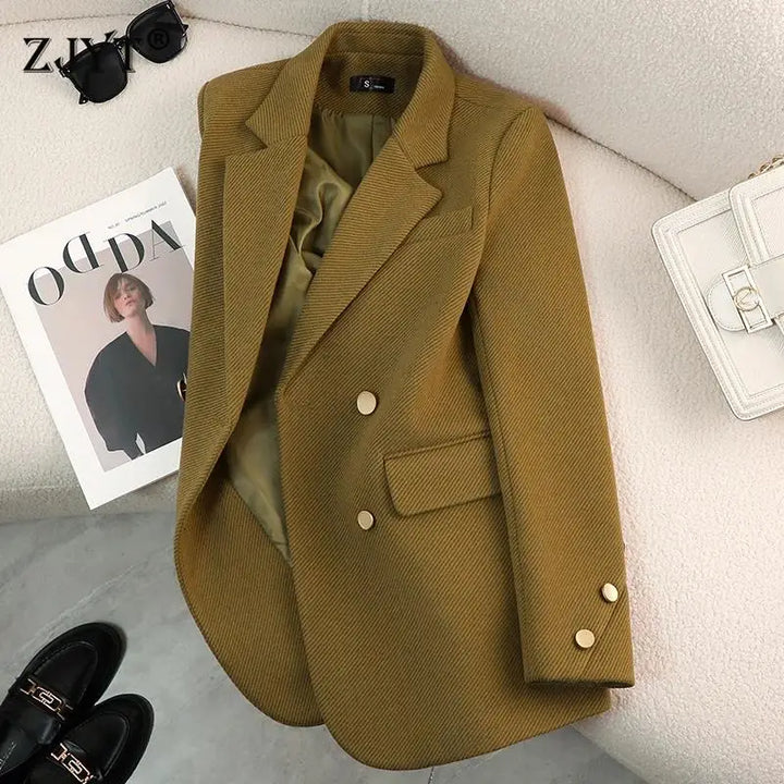 Women's tailored blazer in a sophisticated black, featuring elegant gold button accents and a structured fit
