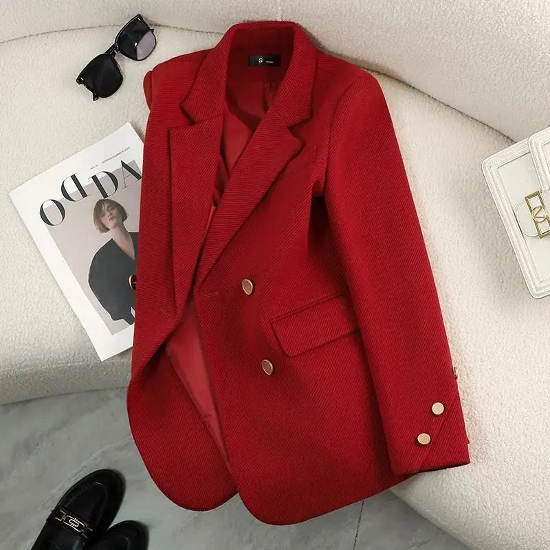 Sophisticated women's blazer with gold button details, offering a structured silhouette for professional and chic wear