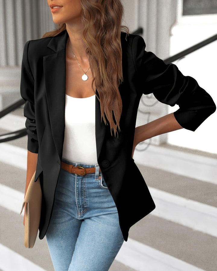 Chic women's ruched sleeve tailored blazer. Single button jacket for elegant professional wear, office, and smart casual fashion.