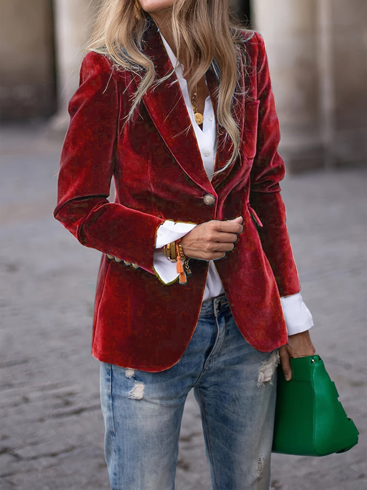 Women's tailored velvet blazer with elegant gold buttons, perfect for a chic, formal look.