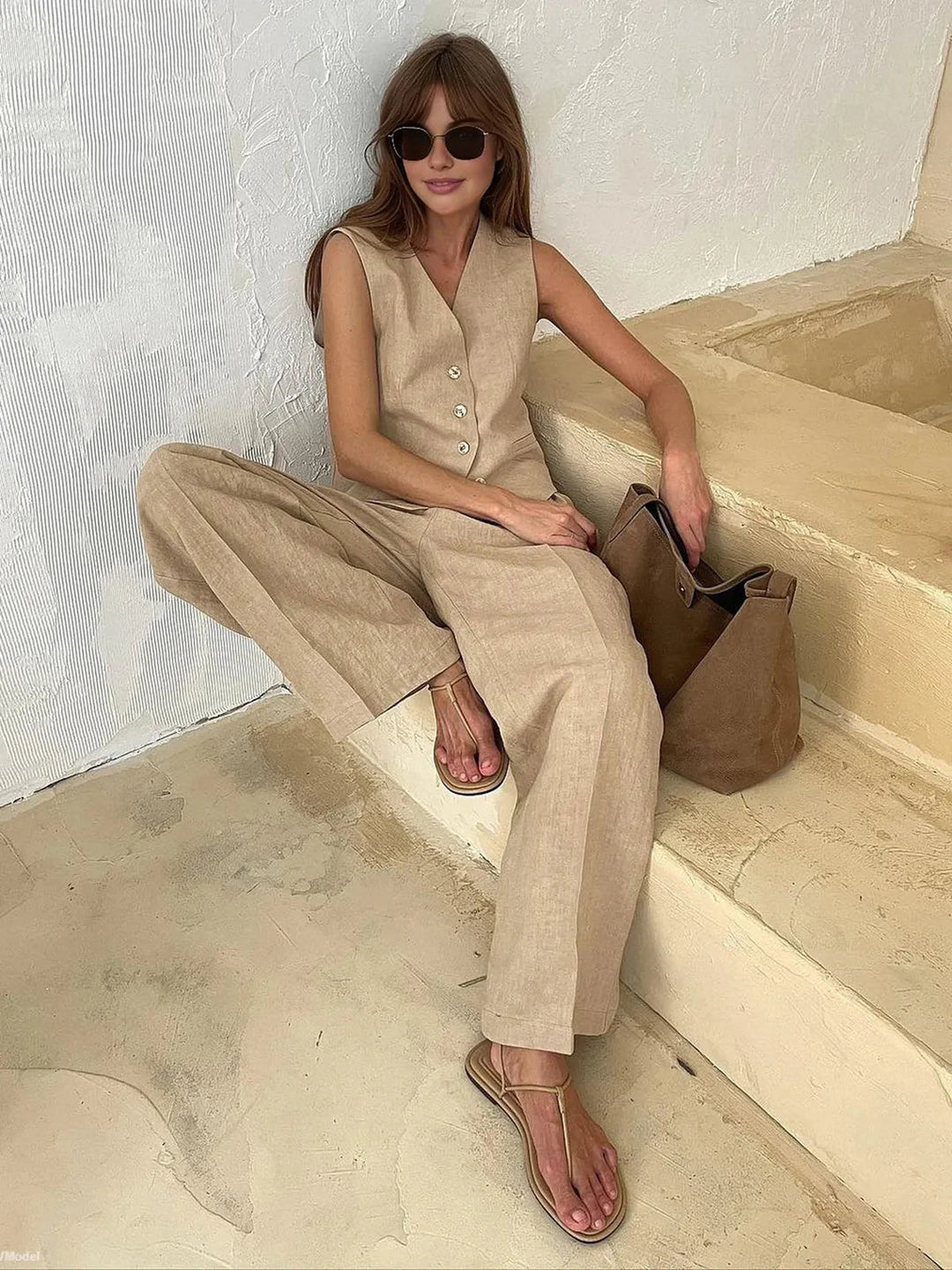 Sophisticated women's tailored waistcoat & wide leg pant set. Elegant matching two-piece for office/summer chic.