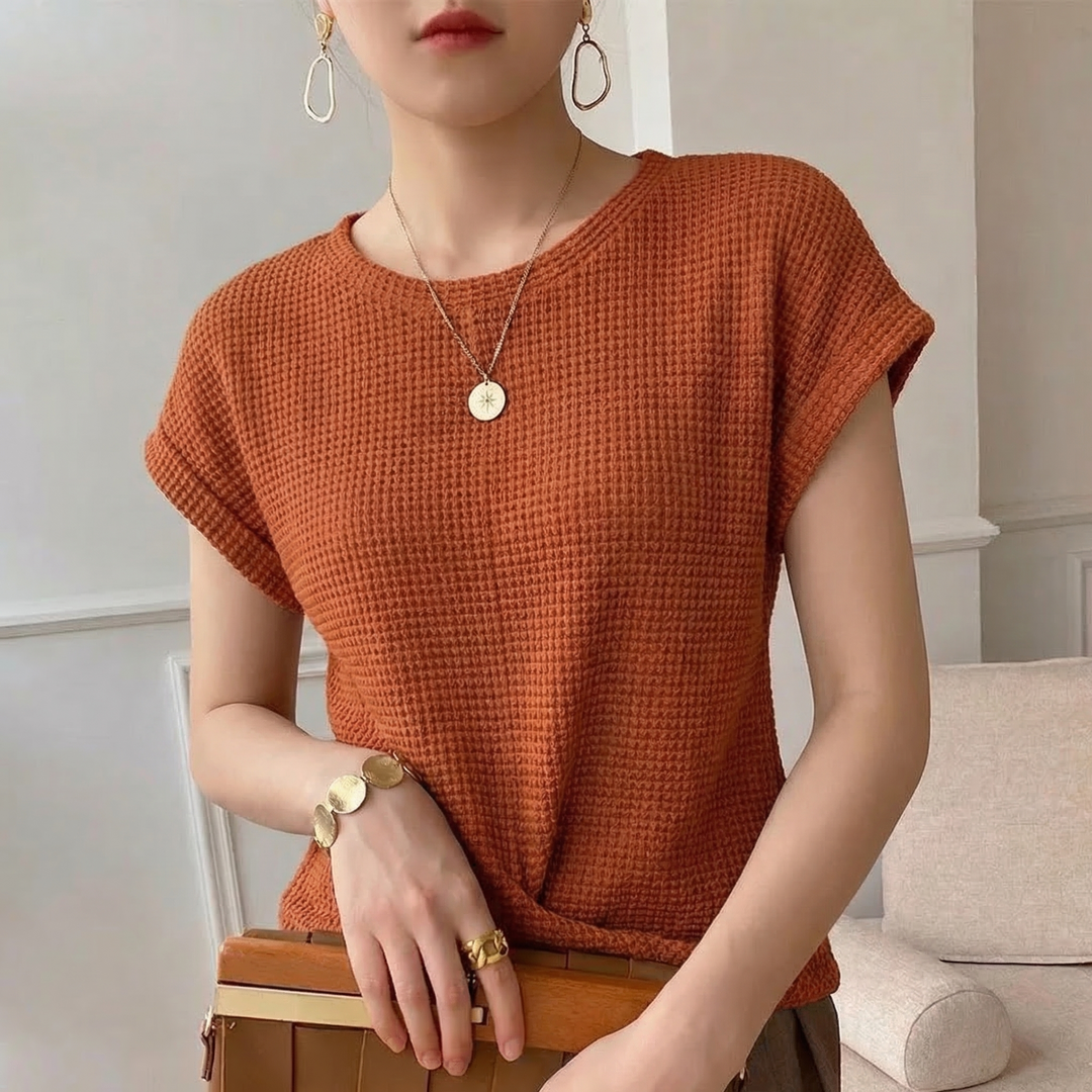 Stylish long sleeve twist front top for women, textured fabric, a comfortable modern casual blouse.