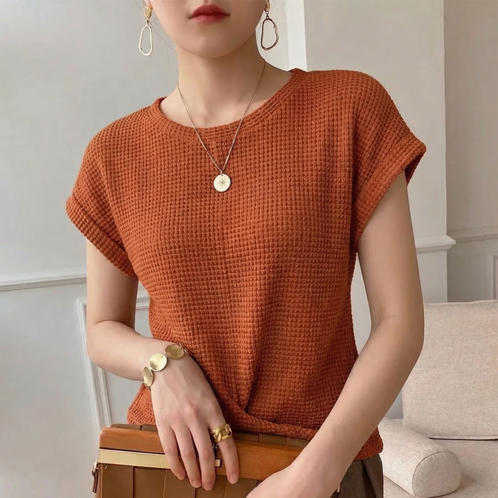 Stylish long sleeve twist front top for women, textured fabric, a comfortable modern casual blouse.