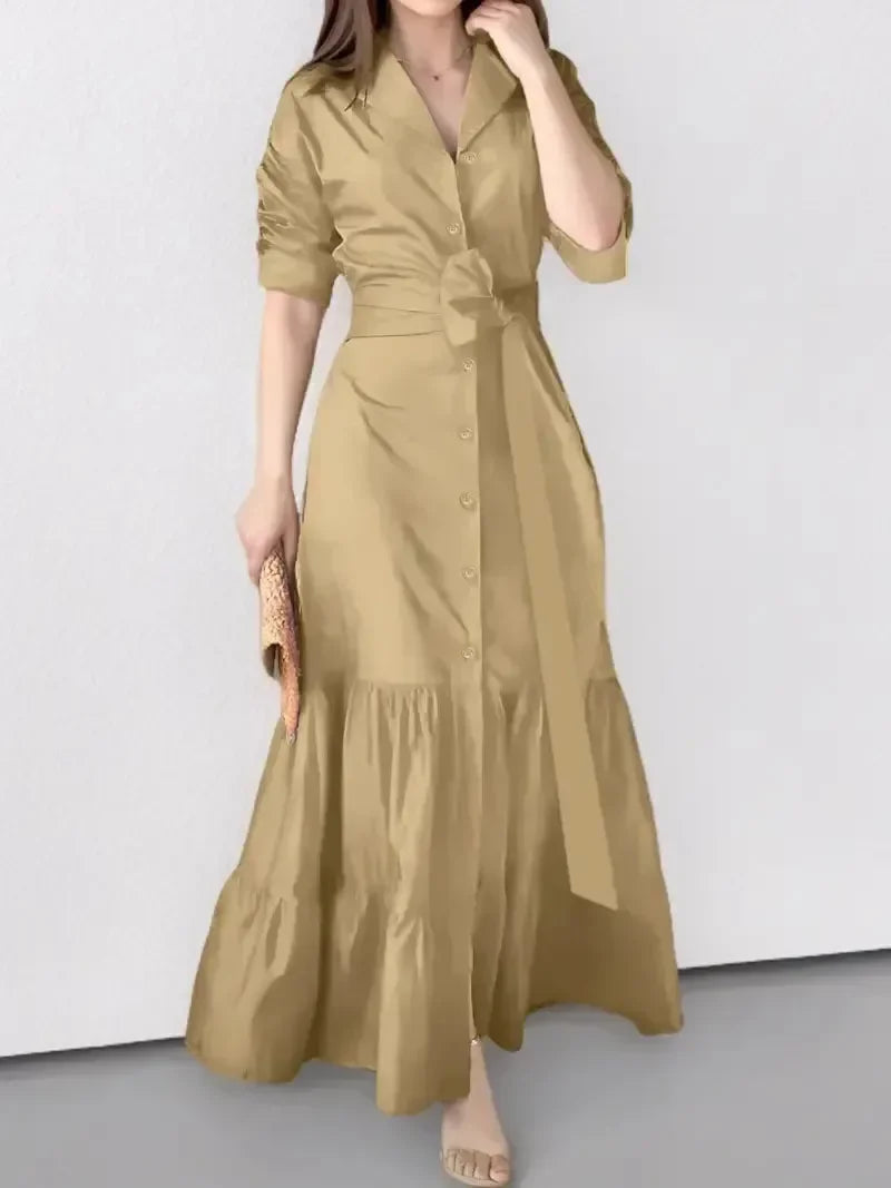New-in women's long sleeve maxi dress. Tiered design, shirt style, and adjustable tie waist for an elegant fit.