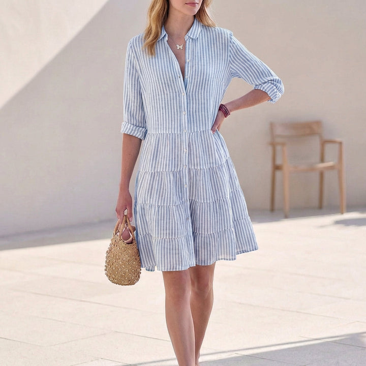 Casual women's shirt dress: a button-down tiered mini with V-neck & 3/4 sleeves for effortless summer style.