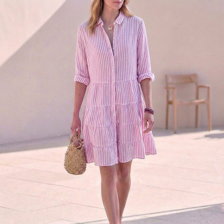 Chic button-down tiered mini dress for women. V-neckline & three-quarter sleeves make this a perfect casual dress.