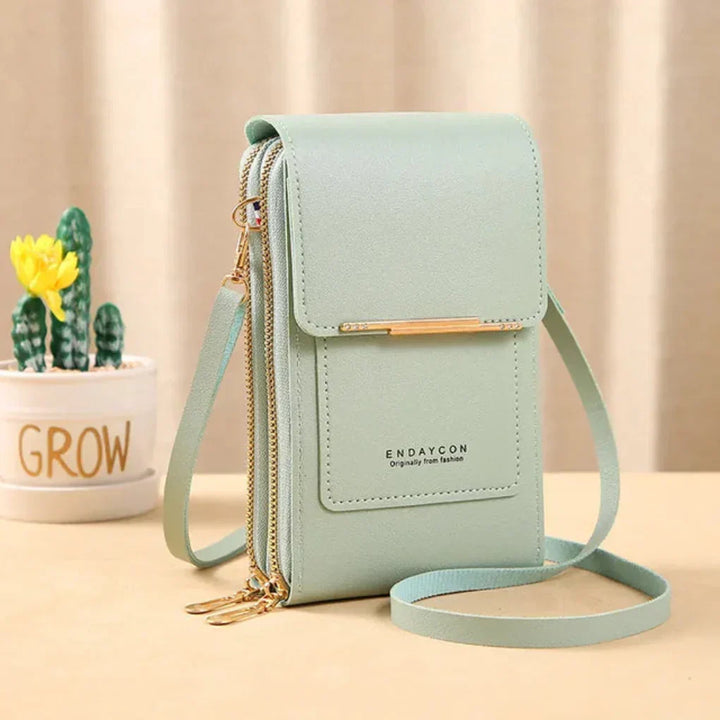 Black women's touch screen phone crossbody bag, perfect small purse for hands-free convenience.