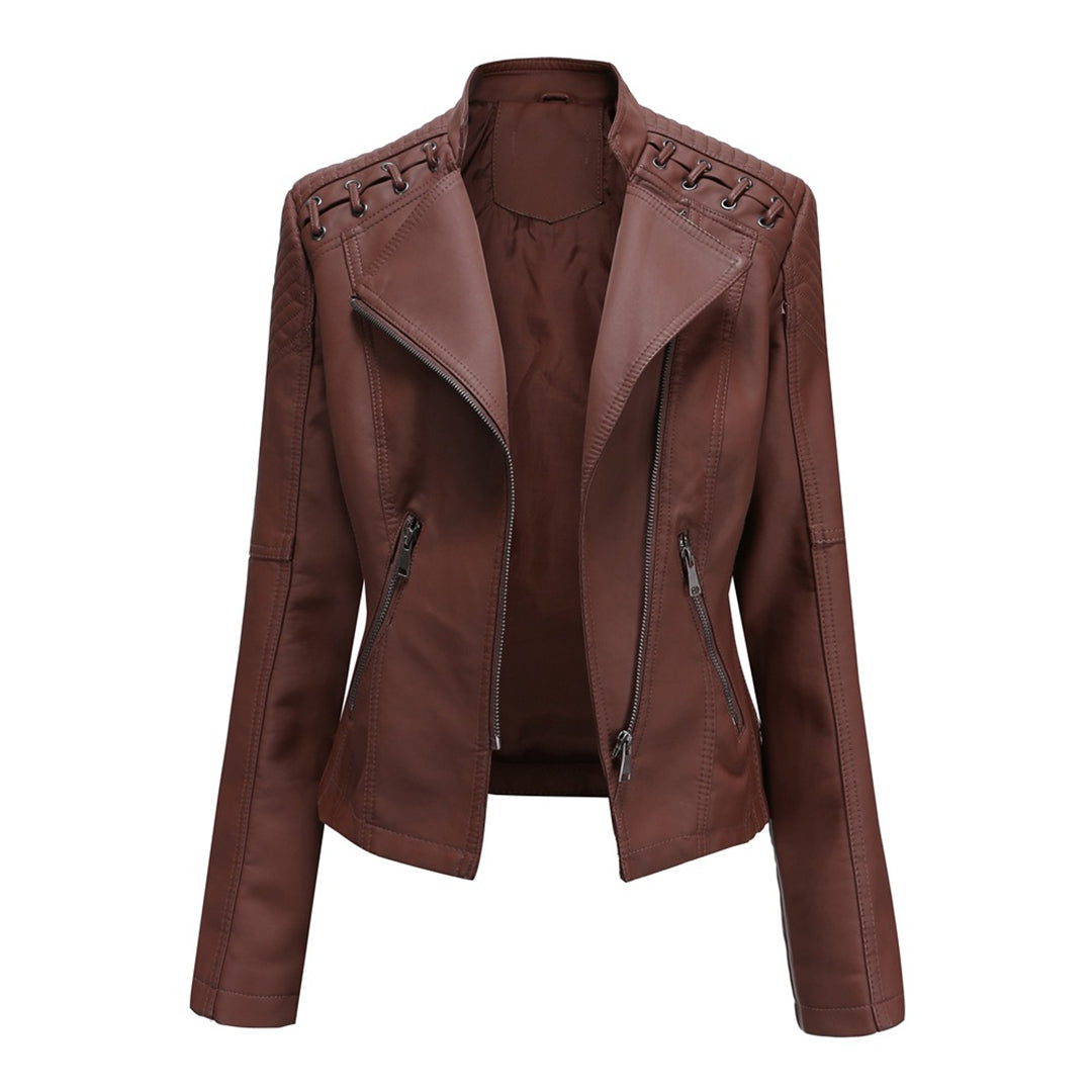 Close-up of the zipper front on a women's faux leather jacket, highlighting the trendy and edgy design