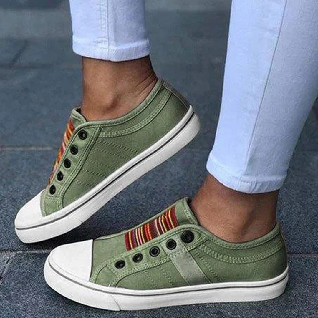 Close-up of women's trendy casual low-top slip-on sneakers, highlighting the textile texture.
