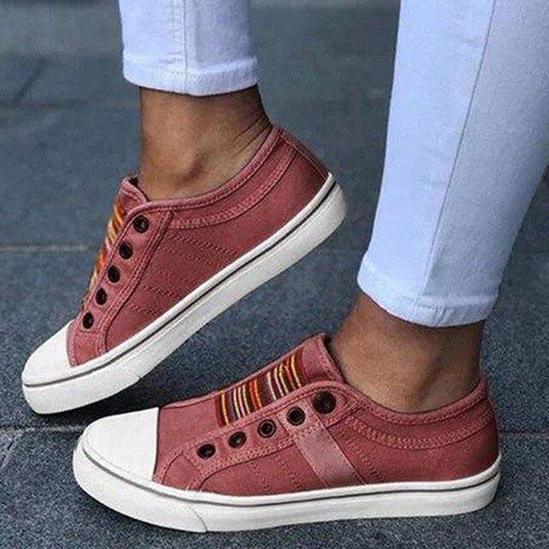 Pair of women's comfortable slip-on low-top sneakers, ideal for combining style and ease.
