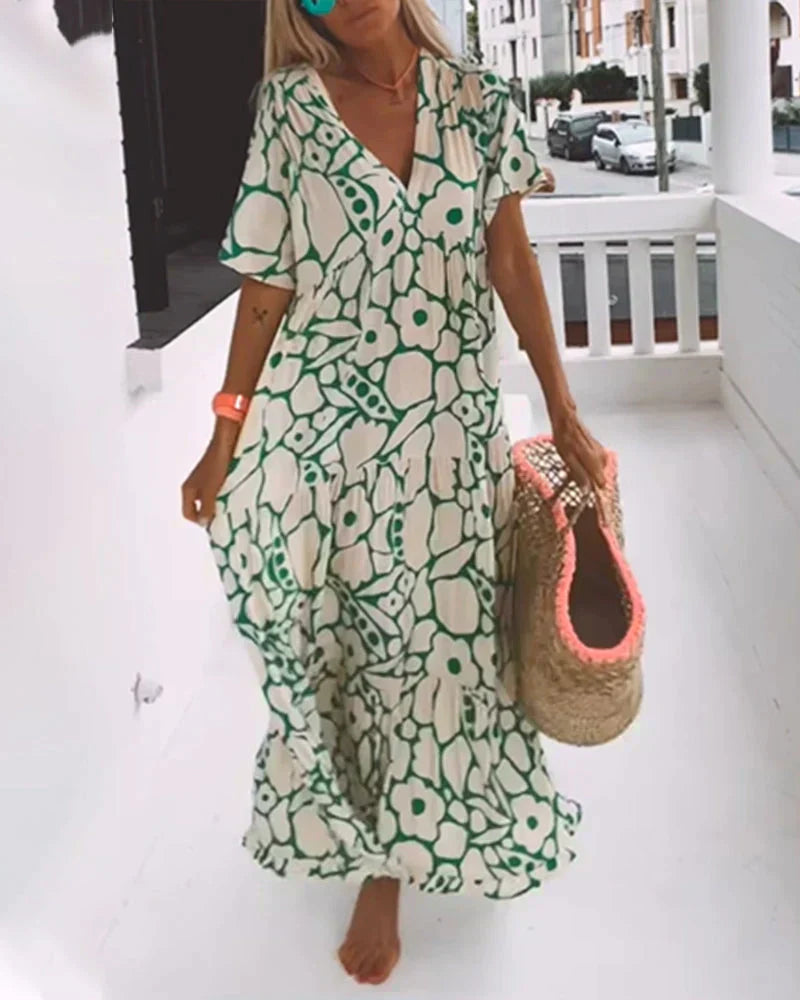 Flowy abstract print V-neck maxi dress, a chic women's summer style for vacation and casual outings.