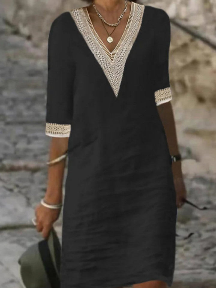 Casual women's V-neck dress with delicate lace trim, 3/4 sleeves & relaxed fit for summer style.