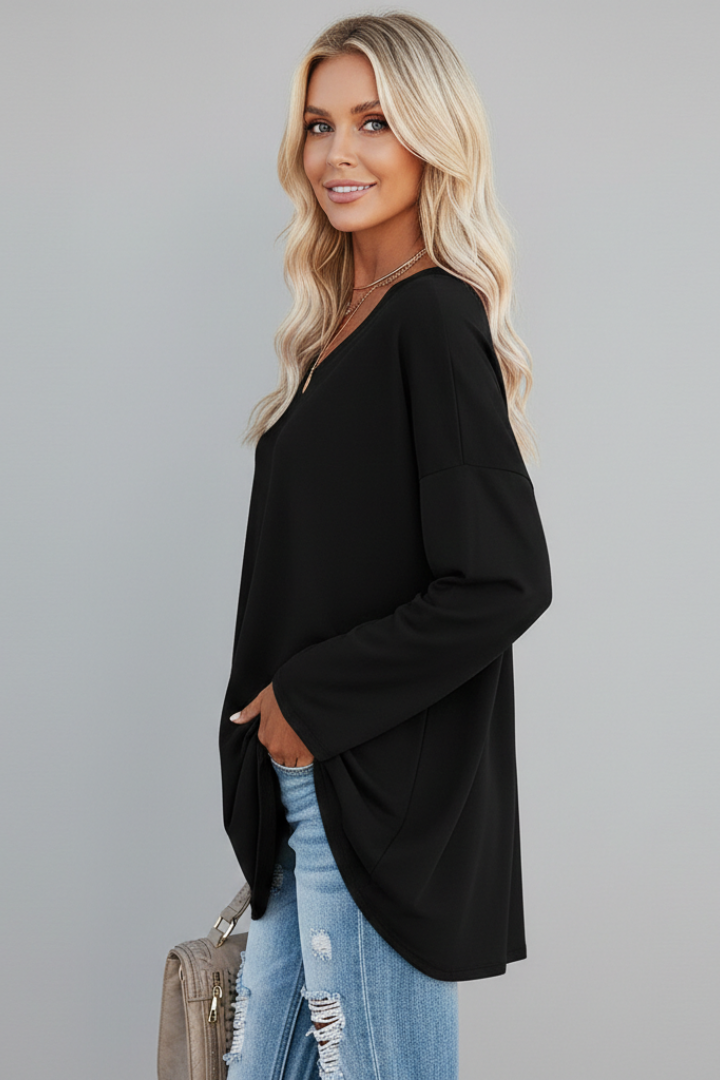 Stylish women's V-neck top with long sleeves, featuring a relaxed fit for ultimate comfort.