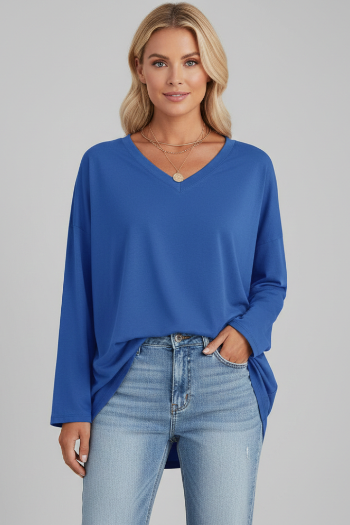 Soft women's V-neck top, long sleeves, relaxed fit for casual, comfortable everyday style.