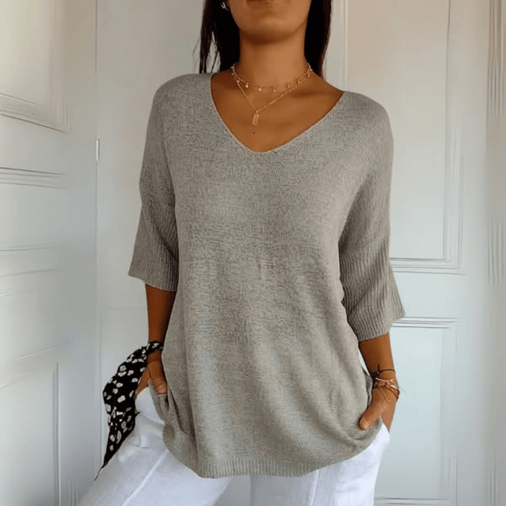 Stylish women's loose V-neck sweater, a casual knit essential for effortless everyday fashion.