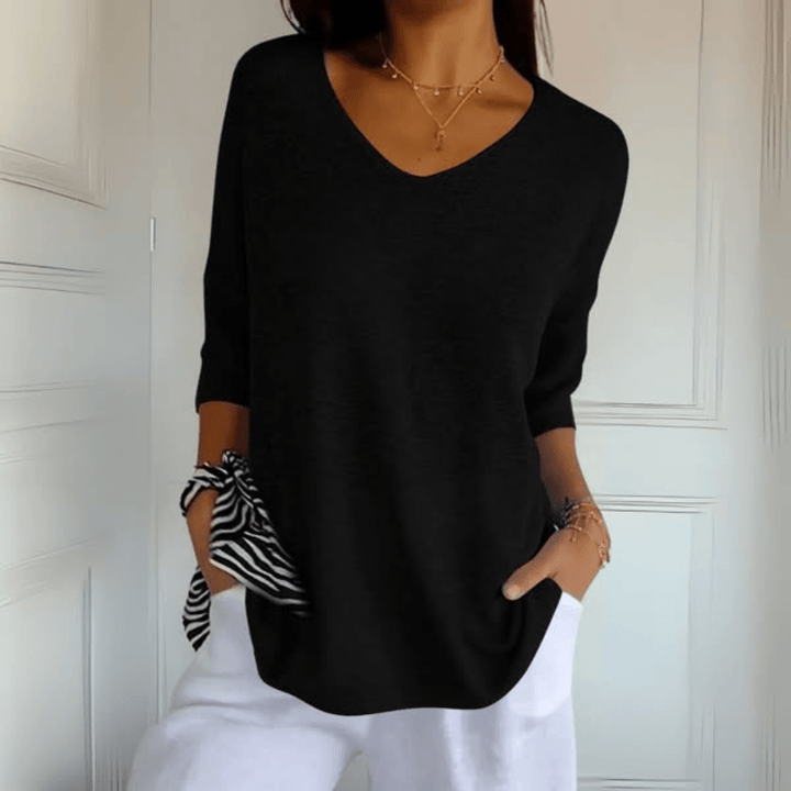 Soft knit women's V-neck sweater in a relaxed, loose fit, perfect for casual comfort.