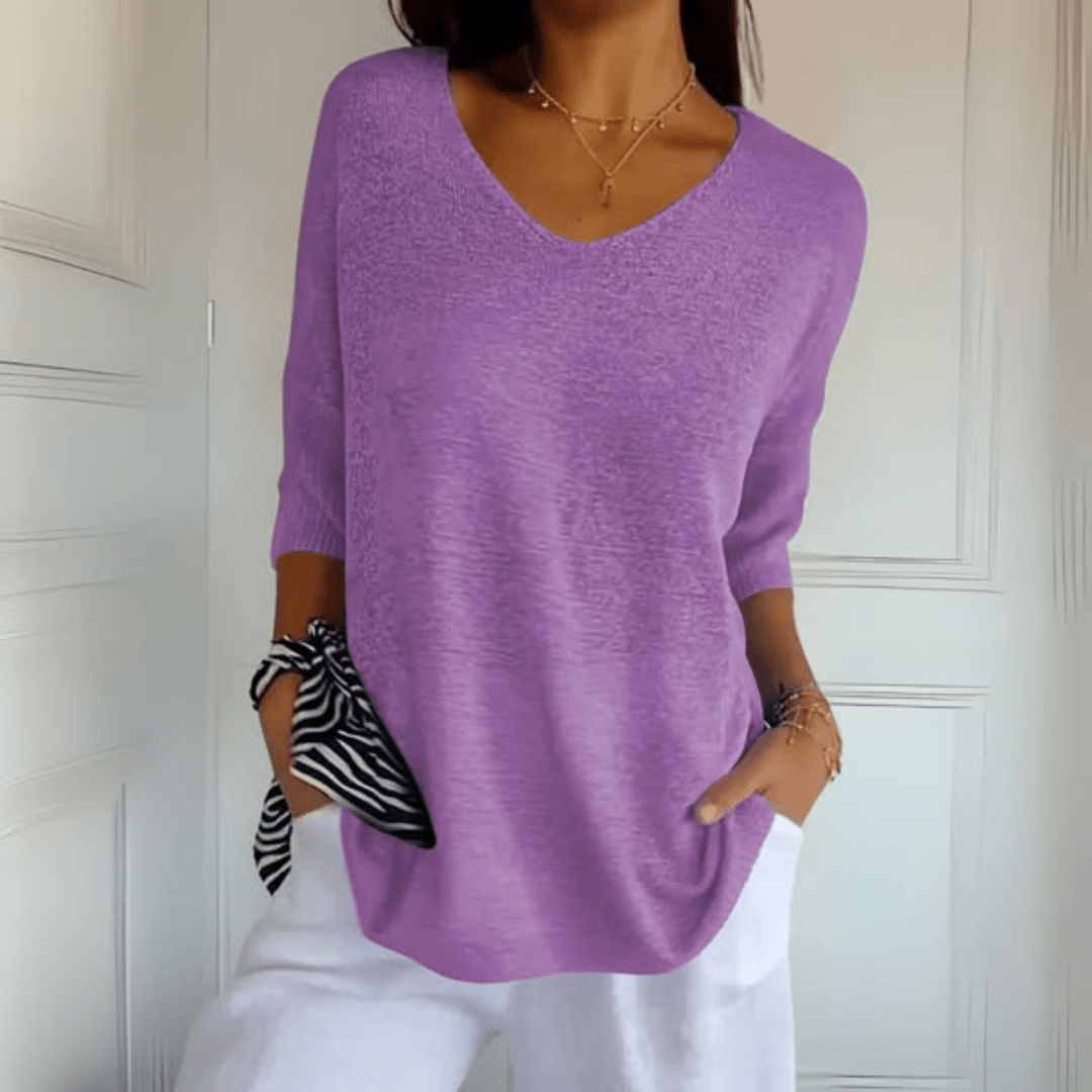 Effortless women's V-neck loose sweater, hip length with three-quarter sleeves for chic daily wear.