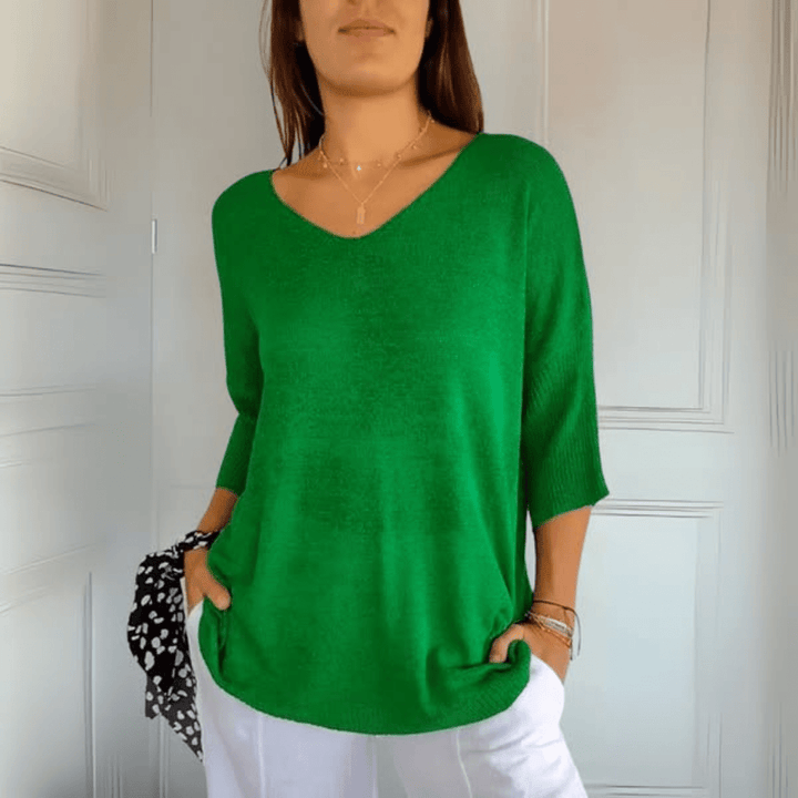 Casual women's V-neck sweater, loose fit & comfortable knit for versatile fall & spring outfits.