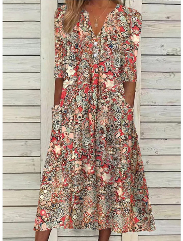 Women's V-neck printed midi summer dress with comfortable 3/4 sleeves & handy pockets.