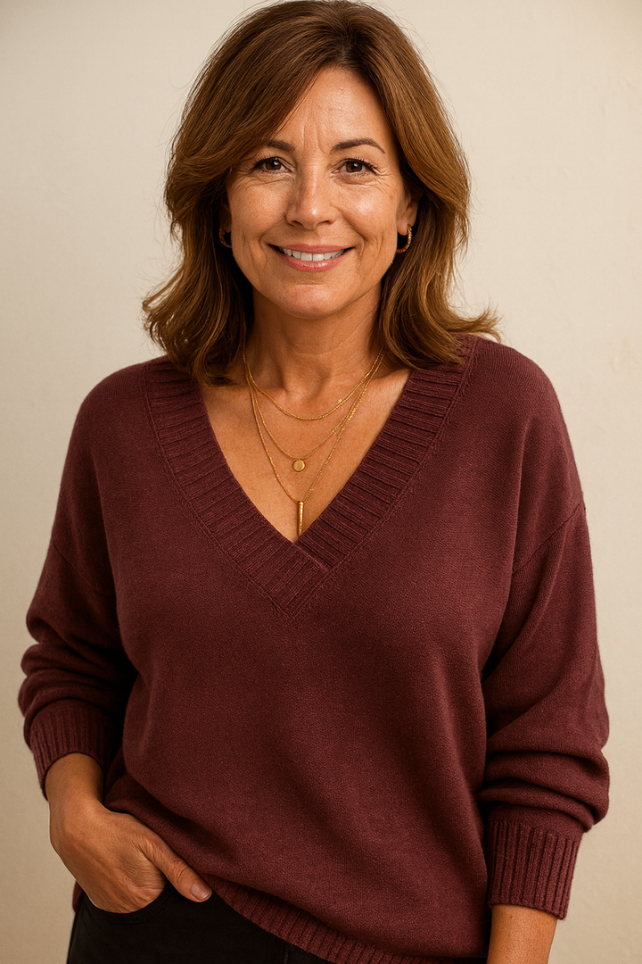 Relaxed fit women's V-neck sweater. Ribbed knit, long sleeves, great for casual comfort.