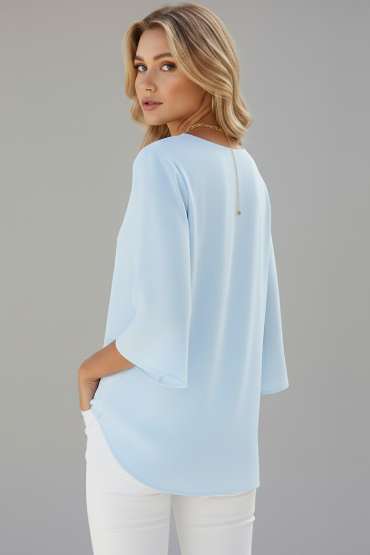Relaxed fit women's V-neck short sleeve blouse, perfect casual top for comfortable everyday style.