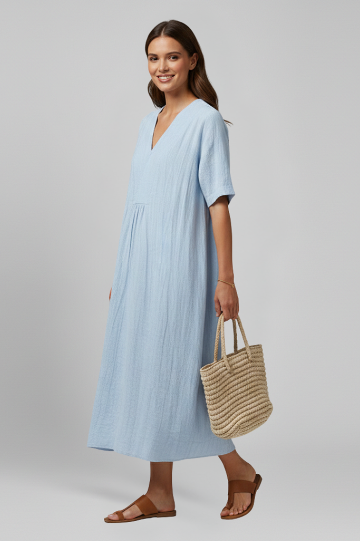 Summer-ready women's V-neck spotted dress. Short sleeve, fit & flare silhouette for an elegant look.