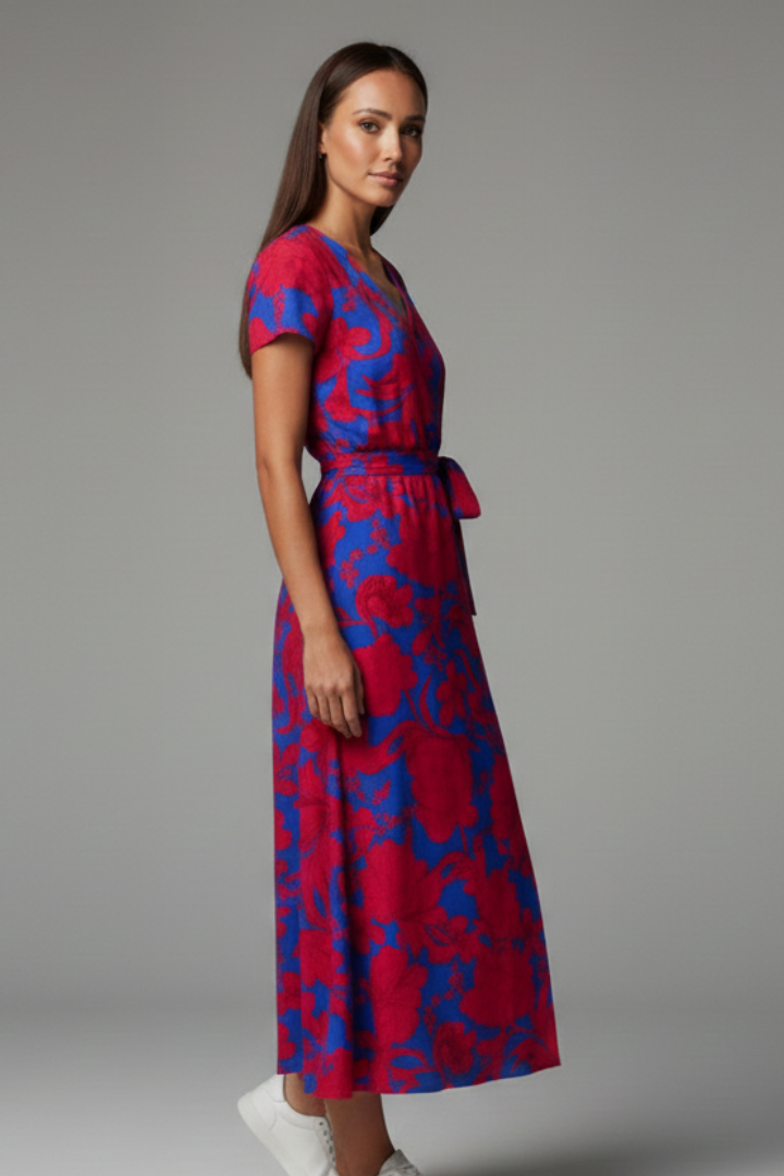 Trendy women's V-neck short sleeve spotted dress. Flattering fit & flare design for modern women's fashion.