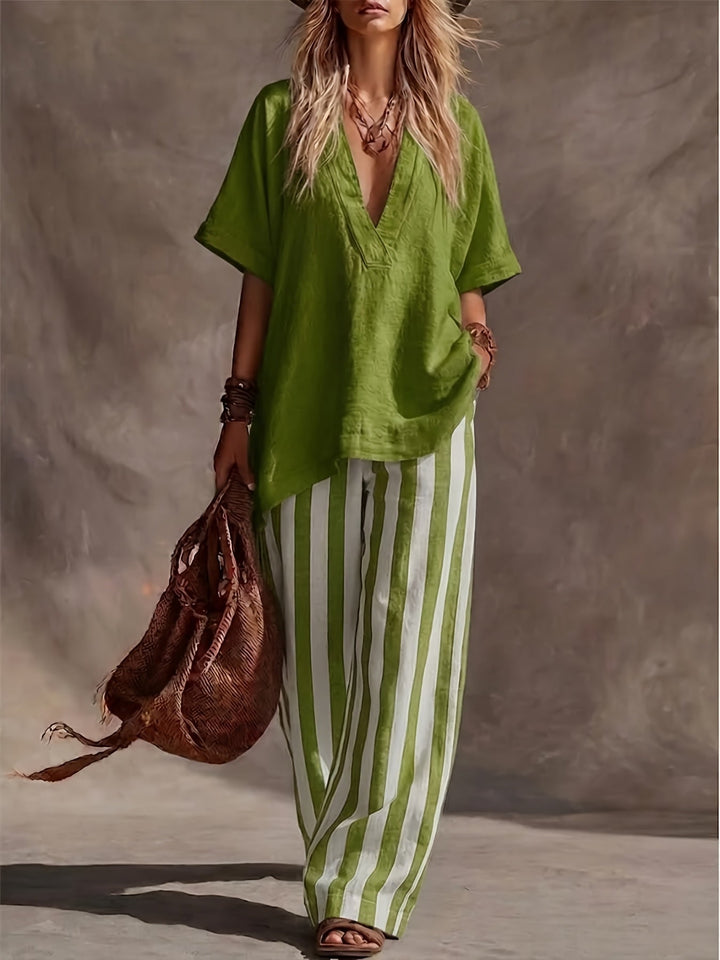 Women's V-neck top and striped wide leg pants coordinated set for chic summer style.